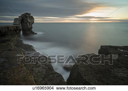 Picture - Pulpit Rock at sunset, Portland, Dorset, England. Fotosearch