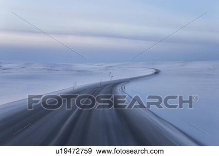 Road curving through snow landscape at Dimmifjallgardur, Iceland View Large Photo Image Stock Photo - Road curving through snow landscape at Dimmifjallgardur, Iceland. Fotosearch