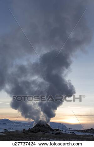 Picture - Steam columns from geothermal fumaroles at sunset, Krafla, Icela. Fotosearch