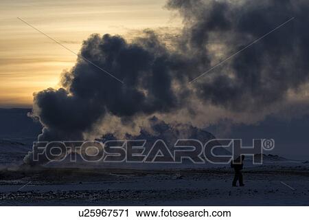 Stock Image - Steam columns from geothermal fumaroles at sunset, Krafla, Icela. Fotosearch