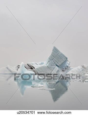 Striped icebergs at Jokulsarlon lagoon, misty sunrise, Iceland View Large Photo Image Stock Image - Striped icebergs at Jokulsarlon lagoon, misty sunrise, Iceland. Fotosearch