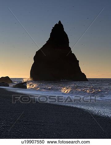Sunrise over Dyrholaey sea stacks, Iceland View Large Photo Image Stock Image - Sunrise over Dyrholaey sea stacks, Iceland. Fotosearch