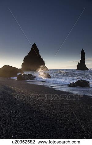 Sunrise over Dyrholaey sea stacks, Iceland View Large Photo Image Stock Image - Sunrise over Dyrholaey sea stacks, Iceland. Fotosearch