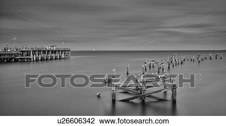 Swanage pier in tranquillity, Dorset, England View Large Photo Image Stock Image - Swanage pier in tranquillity, Dorset, England. Fotosearch