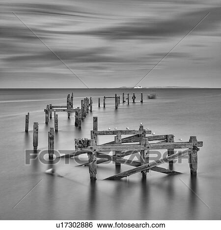 Stock Photograph - Swanage pier in tranquillity, Dorset, England. Fotosearch