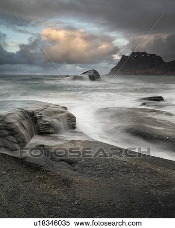 Stock Photography - Tidal pools and waves, Uttakveir at sunset, Norway. Fotosearch