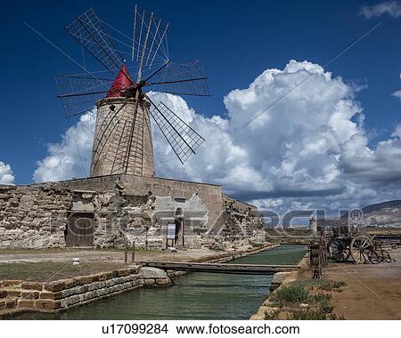 Picture - Windmills at Trapani saline pans, Sicily, Italy. Fotosearch