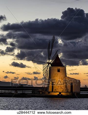 Windmills at Trapani saline pans, twilight, Sicily, Italy View Large Photo Image Stock Image - Windmills at Trapani saline pans, twilight, Sicily, Italy. Fotosearch