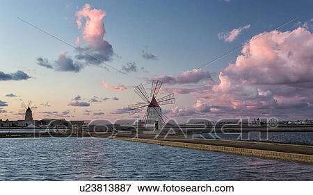Windmills at Trapani saline pans, sunset, Sicily, Italy View Large Photo Image Stock Photo - Windmills at Trapani saline pans, sunset, Sicily, Italy. Fotosearch