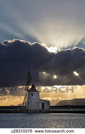Windmills at Trapani saline pans, sunset, Sicily, Italy View Large Photo Image Stock Photograph - Windmills at Trapani saline pans, sunset, Sicily, Italy. Fotosearch