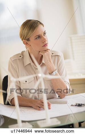 Architect working in firm dealing with wind power View Large Photo Image Picture - Architect working in firm dealing with wind power. Fotosearch
