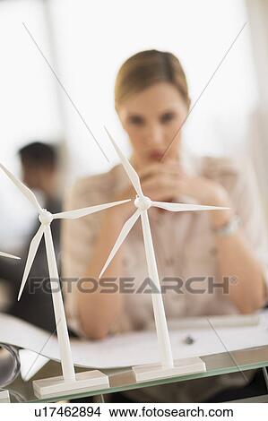 Architect working in firm dealing with wind power View Large Photo Image Picture - Architect working in firm dealing with wind power. Fotosearch