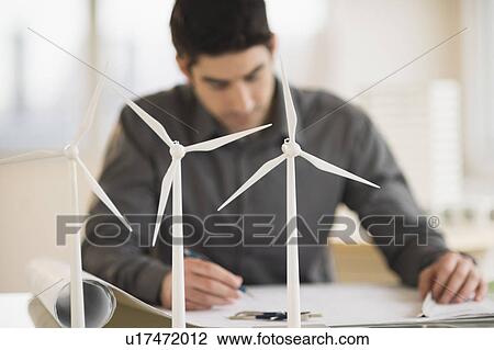 Architect working in firm dealing with wind power View Large Photo Image Stock Image - Architect working in firm dealing with wind power. Fotosearch