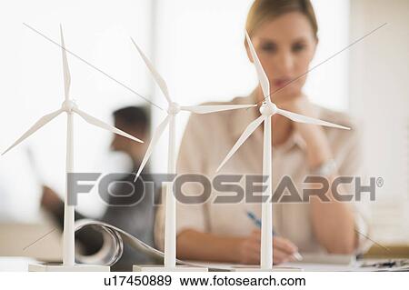 Stock Photo - Architect working in firm dealing with wind power. Fotosearch