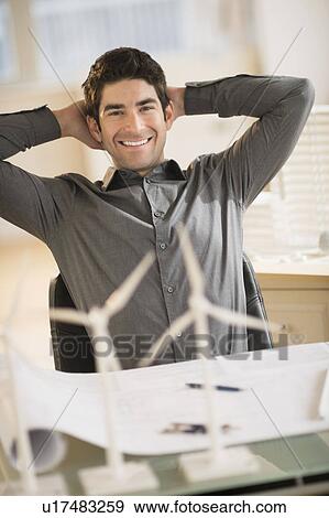 Architect working in firm dealing with wind power View Large Photo Image Stock Photo - Architect working in firm dealing with wind power. Fotosearch