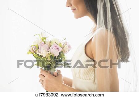 Stock Image - Bride holding bouquet. Fotosearch