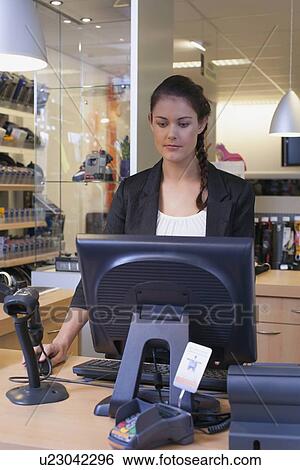 Business owner in sports store View Large Photo Image Stock Photograph - Business owner in sports store. Fotosearch