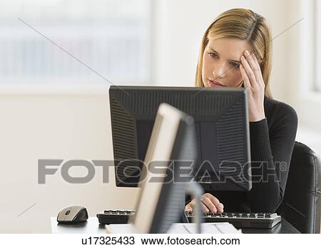 Business woman working in office View Large Photo Image Stock Image - Business woman working in office. Fotosearch