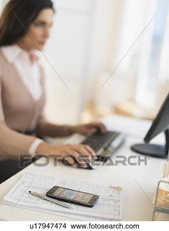 Businesswoman working on computer View Large Photo Image Picture - Businesswoman working on computer. Fotosearch