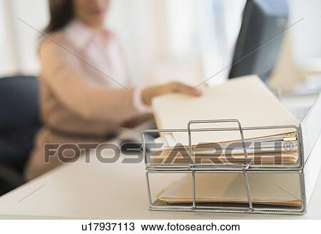 Businesswoman working on computer View Large Photo Image Stock Image - Businesswoman working on computer. Fotosearch