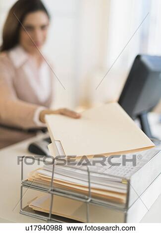 Businesswoman working on computer View Large Photo Image Stock Photo - Businesswoman working on computer. Fotosearch