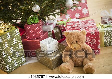 Stock Image - Christmas presents under tree. Fotosearch