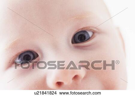 Picture - close up of baby`s face (18-23 months). Fotosearch