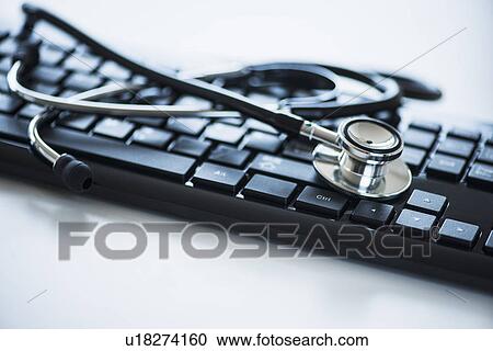 Close up of computer keyboard and stethoscope, studio shot View Large Photo Image Stock Image - Close up of computer keyboard and stethoscope, studio shot. Fotosearch