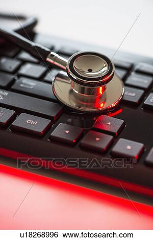 Close up of computer keyboard and stethoscope, studio shot View Large Photo Image Stock Photograph - Close up of computer keyboard and stethoscope, studio shot. Fotosearch