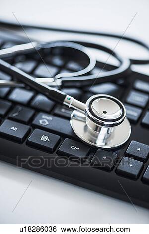 Close up of computer keyboard and stethoscope, studio shot View Large Photo Image Stock Photograph - Close up of computer keyboard and stethoscope, studio shot. Fotosearch