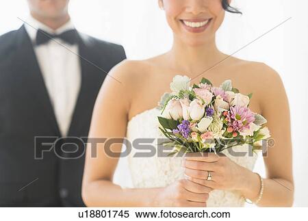 Stock Photography - Close up of newlywed couple. Fotosearch
