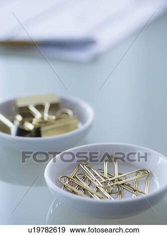 Close-up of paper clip and binder clip View Large Photo Image Stock Photo - Close-up of paper clip and binder clip. Fotosearch