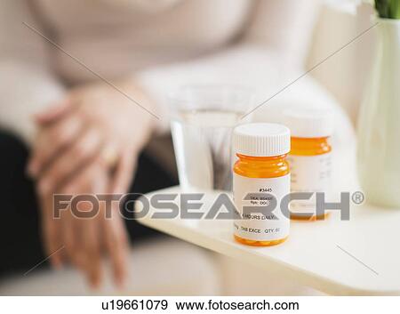 Stock Photo - Close-up of pill bottles. Fotosearch