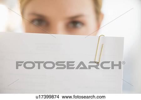 Close-up of young woman reading documents View Large Photo Image Picture - Close-up of young woman reading documents. Fotosearch