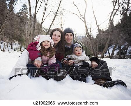 Stock Photograph - Family portrait with two children (2-3, 12-17 months) . Fotosearch
