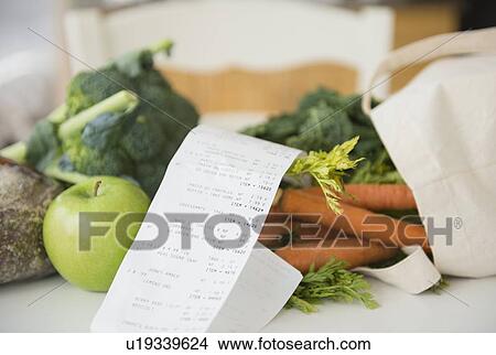 Fresh vegetables with store bill View Large Photo Image Picture - Fresh vegetables with store bill. Fotosearch