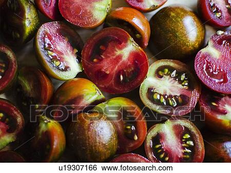 Freshly cut tomatoes View Large Photo Image Stock Photograph - Freshly cut tomatoes. Fotosearch