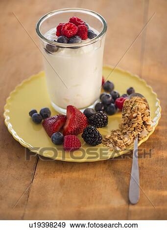 Healthy breakfast with fruits, cereal and yoghurt View Large Photo Image Stock Photo - Healthy breakfast with fruits, cereal and yoghurt. Fotosearch