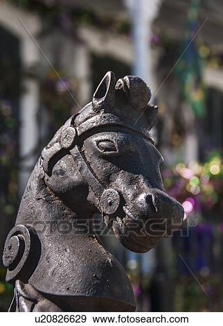 Stock Photo - Horse statue in front of old building. Fotosearch