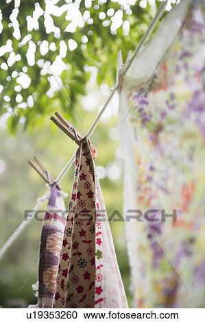 Stock Image - Laundry hanging on garden rope. Fotosearch