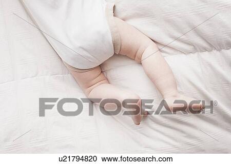 Low section of baby boy (18-23 months) lying on front View Large Photo Image Stock Image - Low section of baby boy (18-23 months) lying on front. Fotosearch