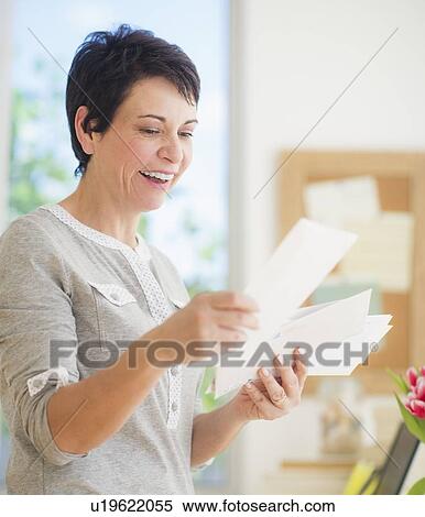 Mature woman reading letters View Large Photo Image Stock Photography - Mature woman reading letters. Fotosearch