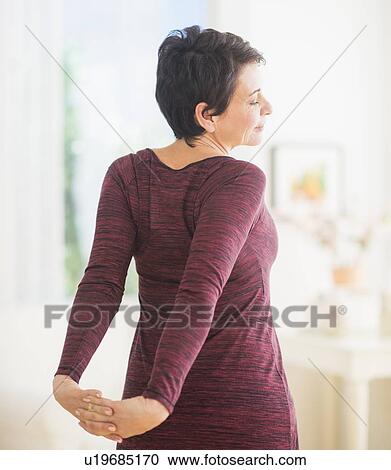Mature woman stretching View Large Photo Image Stock Image - Mature woman stretching. Fotosearch
