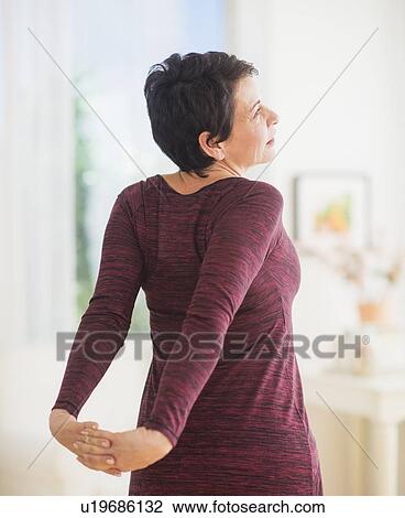Mature woman stretching View Large Photo Image Stock Image - Mature woman stretching. Fotosearch