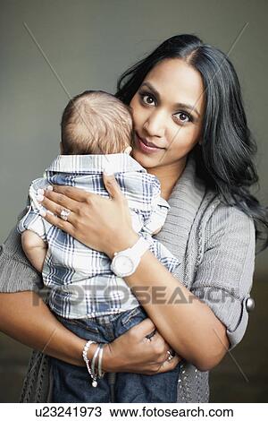 Mother holding her son (2-5 months) View Large Photo Image Stock Image - Mother holding her son (2-5 months). Fotosearch