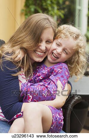 Mother with daughter (2-3) hugging and laughing View Large Photo Image Stock Image - Mother with daughter (2-3) hugging and laughing. Fotosearch