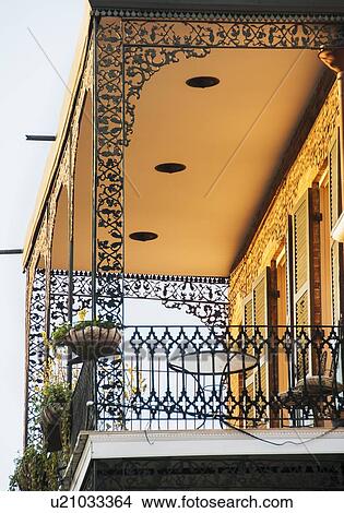Picture - Ornate balcony with potted plants. Fotosearch