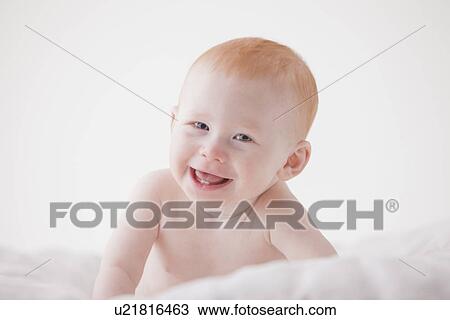 Stock Image - Portrait of baby boy (18-23 months) laughing. Fotosearch