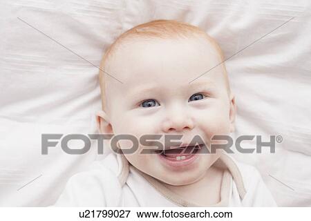 Portrait of baby boy (18-23 months) laughing View Large Photo Image Stock Photo - Portrait of baby boy (18-23 months) laughing. Fotosearch