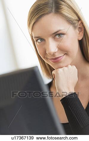 Portrait of business woman using computer View Large Photo Image Stock Photo - Portrait of business woman using computer. Fotosearch